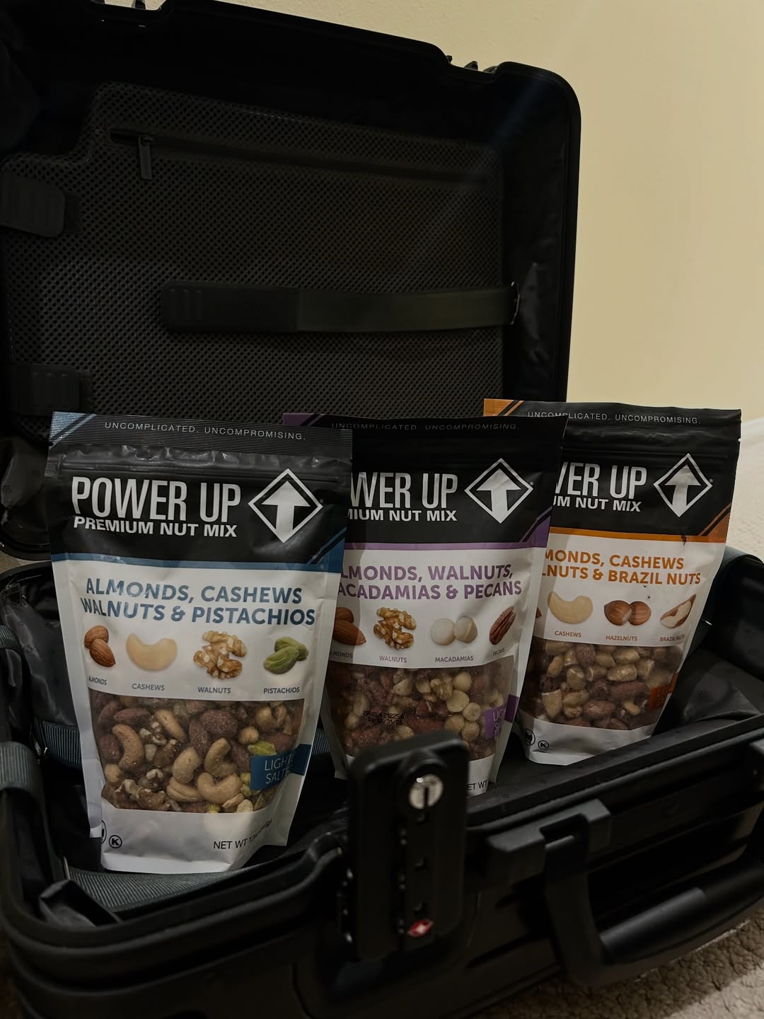 Power Up nut-mix bags packed in a suitcase